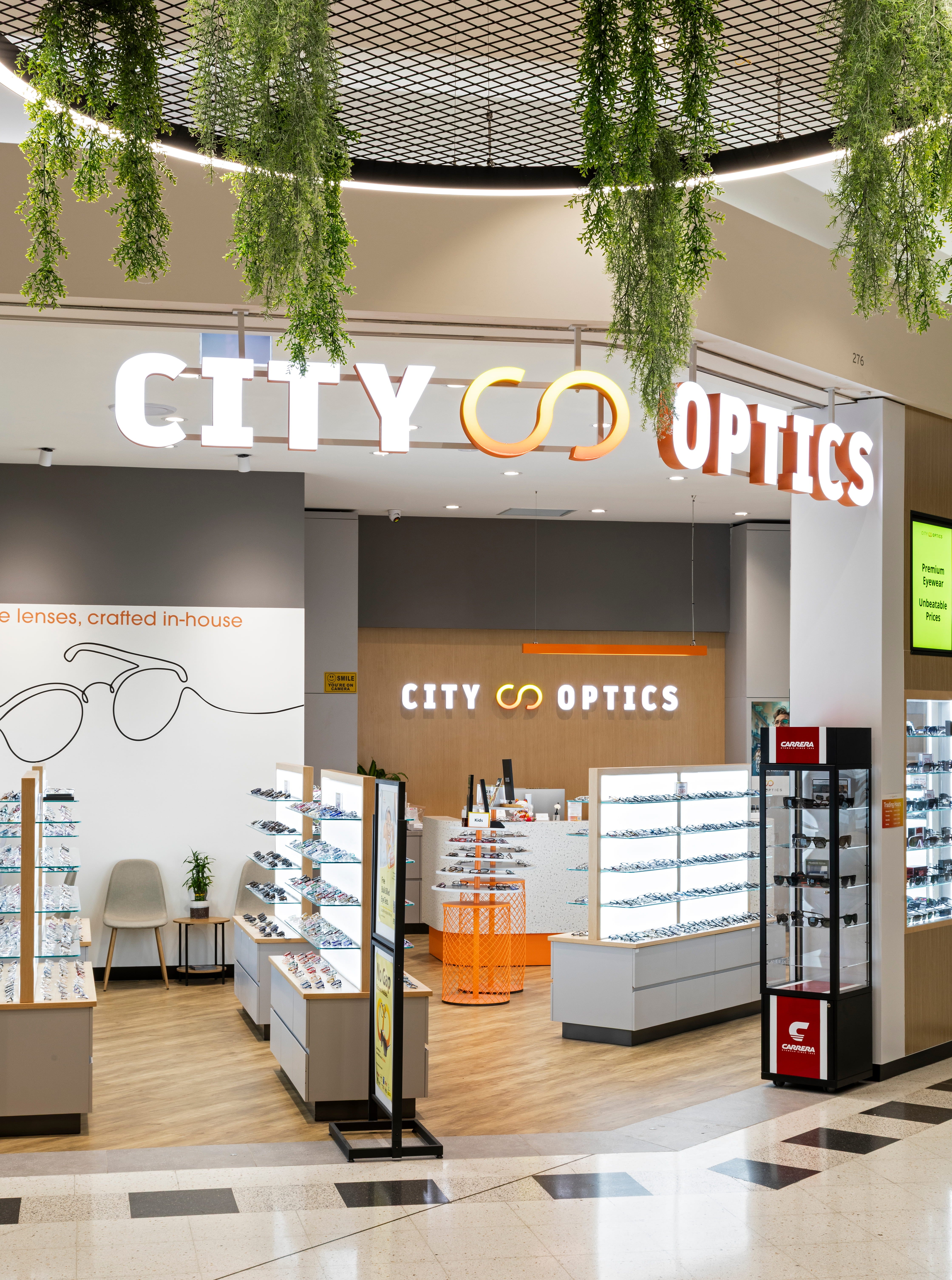 Designer sunglasses and optical store display at City Optics