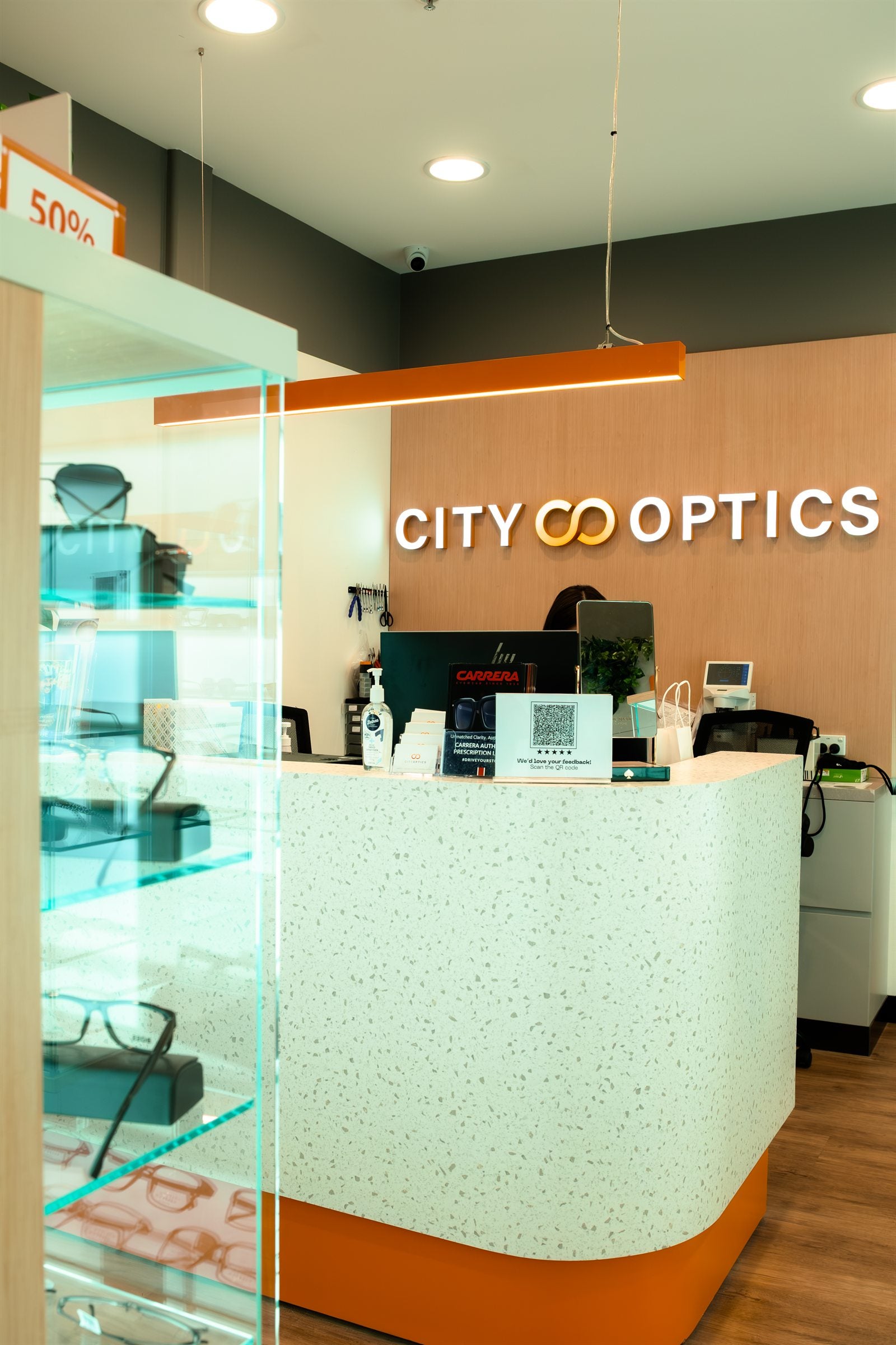 City Optics front counter with store signage and optical support desk