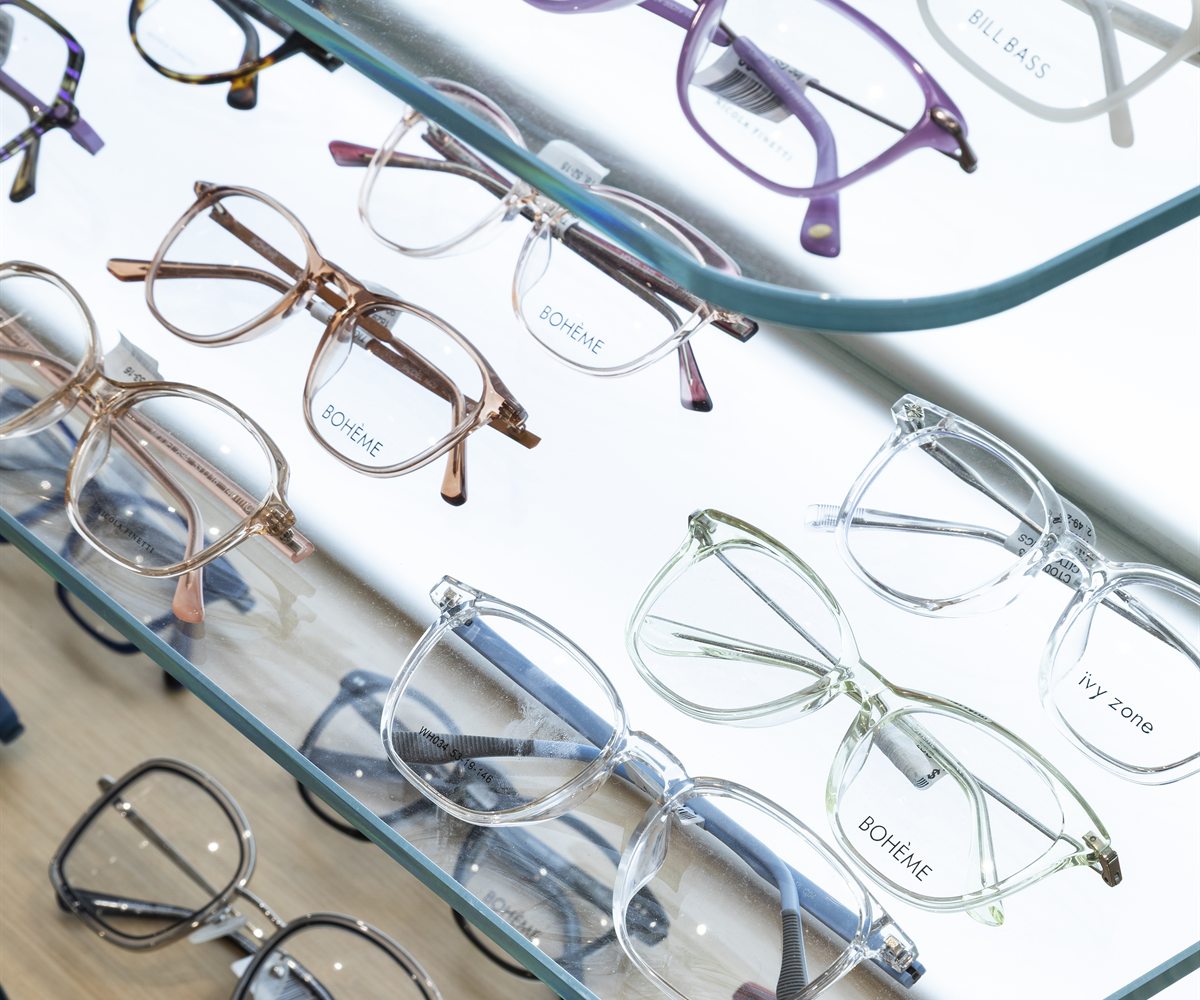 Optical frames displayed on a City Optics frame shelf